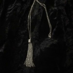 Silver chain with tassel.
